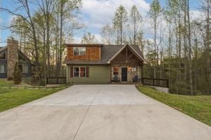 a house with a large driveway in front of it at Grizzly Glam in Gatlinburg +39 photos