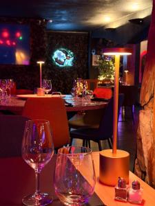 a restaurant with wine glasses on a table at La Terrasse Des Spas - Restaurant - Institut Massage in Hazebrouck