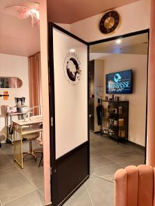 a door to a therapy room with a mirror at La Terrasse Des Spas - Restaurant - Institut Massage in Hazebrouck