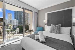 a bedroom with a large bed and a large window at Ocean View Suite 2 Beds Wi-Fi Netflix in Gold Coast