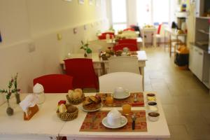 a table with food on it in a restaurant at Agua De Coco in Villa Gesell