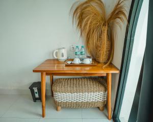 a wooden table with a basket on top of it at Hideout Kintamani and Hot Spring in Kintamani