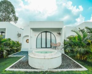 a house with a large tub in the yard at Hideout Kintamani and Hot Spring in Kintamani +54 photos