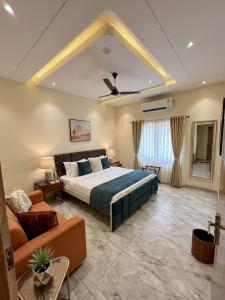 a large bedroom with a bed and a couch at Raman Resort Hotel and Banquet in Gagargārh