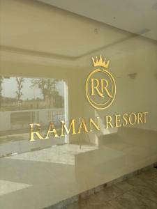 a sign in the window of a raniani resort at Raman Resort Hotel and Banquet in Gagargārh