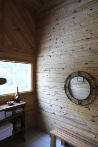 a log cabin with a window and a wooden wall at Charming 3-bedroom Angel Fire Cabin in Angel Fire