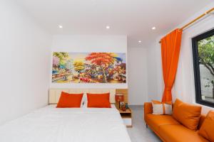 a bedroom with a bed and a couch at Aura Retreat Boutique Hotel Hanoi in Hanoi