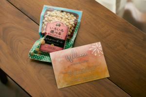 a table with a wedding invitation and a card at Solana 鴨川 in Kamogawa