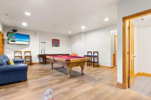 a living room with a pool table in it at 6120 - Yankee Clipper in Nags Head