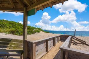 a boardwalk to the beach with the ocean in the background at 6120 - Yankee Clipper in Nags Head