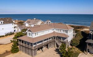 an aerial view of a house with the ocean at 6120 - Yankee Clipper in Nags Head +65 photos