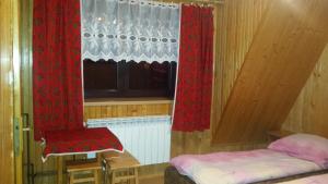 Posteľ alebo postele v izbe v ubytovaní Pokoje Zakopane