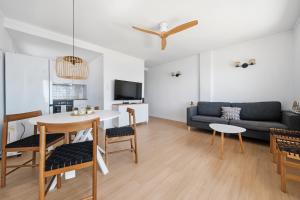 a living room with a couch and a table at Vista Roses Mar - Ariadna in Roses