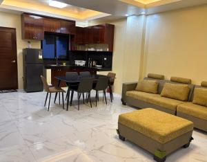 a living room with a couch and a table and chairs at Three Bedrooms Two Storey Home with Parking in Santa Rosa