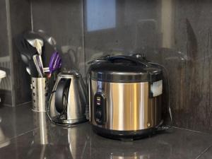 a toaster sitting on top of a kitchen counter at Three Bedrooms Two Storey Home with Parking in Santa Rosa