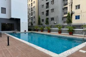 a large swimming pool in the middle of a building at Fafje Luxury in Mama