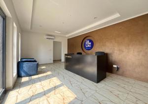 a lobby with a reception desk in a building at Fafje Luxury in Mama