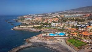 an aerial view of a resort near the ocean at Apartamento Duque Beach in Adeje