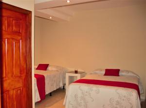 Postel nebo postele na pokoji v ubytování Apart Hotel Express