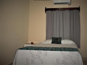 Postel nebo postele na pokoji v ubytování Apart Hotel Express