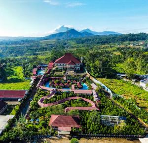 an aerial view of a resort with mountains in the background at Griya Yodesiya Resort Semarang in Karangjati +23 photos