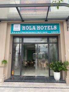 a restaurant with a sign that reads hola hotels at Hola Hotels Móng Cái in San Cap