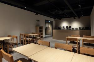 a restaurant with tables and chairs and a counter at Anook Hotel Suwon Ingye 2 in Suwon