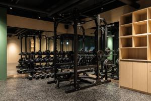 a gym with a lot of weights at Anook Hotel Suwon Ingye 2 in Suwon