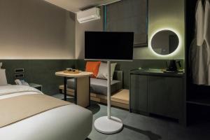 a hotel room with a bed and a tv at Anook Hotel Suwon Ingye 2 in Suwon +162 photos