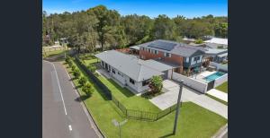 an aerial view of a house with a pool at 1 Seaspray Avenue in Coolum Beach