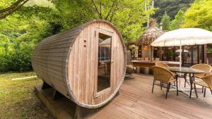 a small wooden boat sitting on a wooden deck at Green Soochaehwa Pension Yangyang in Yangyang