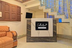 a lobby with a staircase and a sign for a waiting room at Collection O NIT Srinagar Formerly Main Street Inn in Srinagar