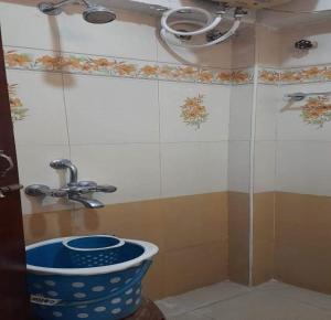 a bathroom with a sink and a shower at Ajantha Beach Guest House in Pondicherry