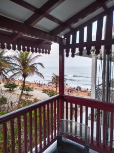 a balcony with a view of the beach at Ajantha Beach Guest House in Pondicherry