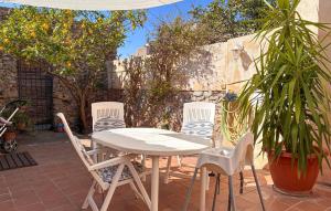 a white table and chairs on a patio at Puresa in Artá +21 photos