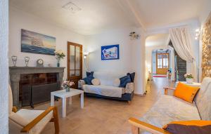 a living room with a couch and a fireplace at Puresa in Artá
