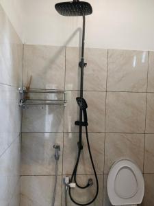 a shower in a bathroom with a toilet at Jay Guest House Gili Gede in Sekotong +59 photos