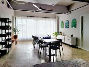 a dining room with tables and chairs and a ceiling at SiSu2 in Chilgok