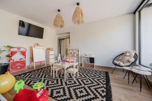 a childs room with a table and a dining room at Solena Villa in Stavromenos
