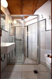 a bathroom with a shower and a sink at Theophano Art Hotel in Monemvasia