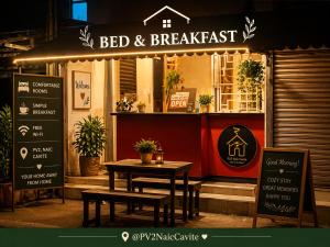 a bed and breakfast restaurant with a table in front of it at Bed and Breakfast at PV2NaicCavite in Naic +5 photos