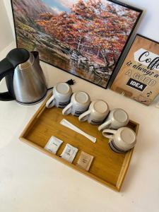 a tray with cups and chopsticks on a table at Paraiso Del Bacnotan in Bacnotan
