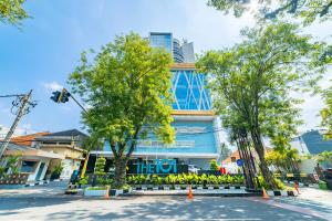 a building with a traffic light in front of it at THE 1O1 Malang OJ in Malang