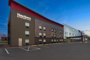 a rendering of a hotel with a parking lot at Hawthorn Extended Stay by Wyndham Jackson in Jackson