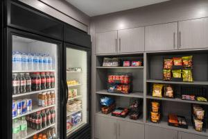 a kitchen with a refrigerator and lots of food at Hawthorn Extended Stay by Wyndham Jackson in Jackson