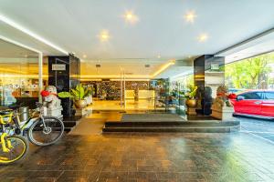 a lobby of a building with a car parked in it at THE 1O1 Malang OJ in Malang