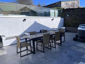 a table and chairs sitting on a patio at Croyde Barn in Croyde