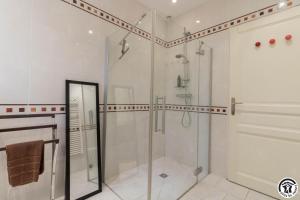 a bathroom with a shower and a glass shower stall at Villa les paradoux in Pin-Balma +44 photos