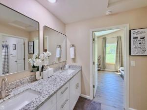 a bathroom with two sinks and a large mirror at Family-Friendly Yosemite Nest in Mariposa +30 photos