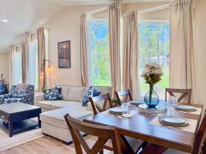 a living room with a table and a couch at Family-Friendly Yosemite Nest in Mariposa